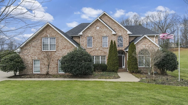 front facade featuring a front yard