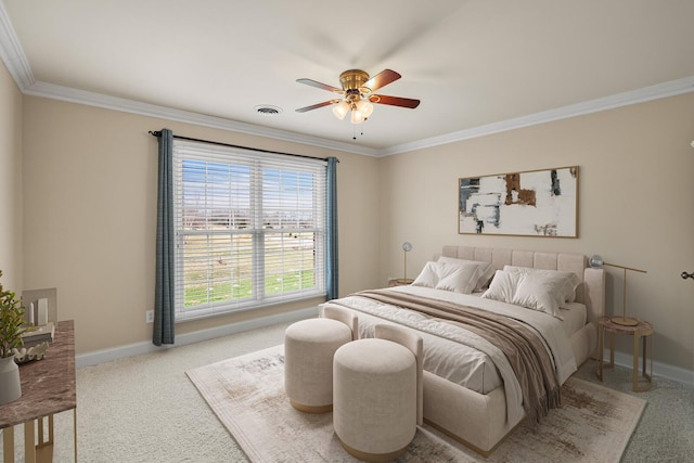 carpeted bedroom with ornamental molding and ceiling fan