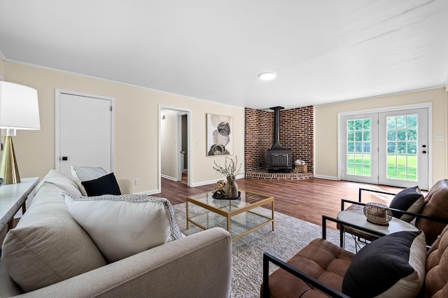 living room with hardwood / wood-style flooring and a wood stove