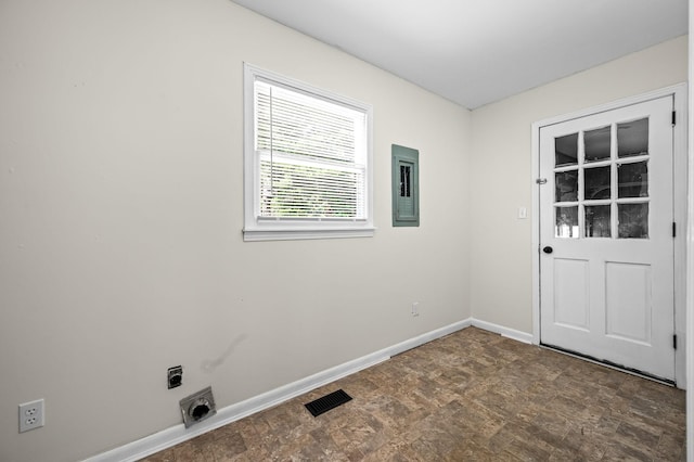 interior space with electric dryer hookup and electric panel