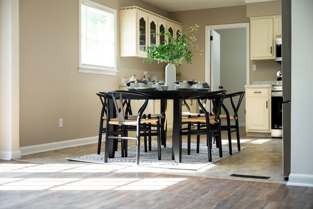 dining space with light wood-type flooring