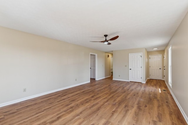 unfurnished bedroom with hardwood / wood-style floors and ceiling fan