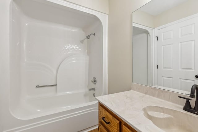 bathroom featuring vanity and bathing tub / shower combination