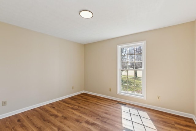 empty room featuring wood-type flooring