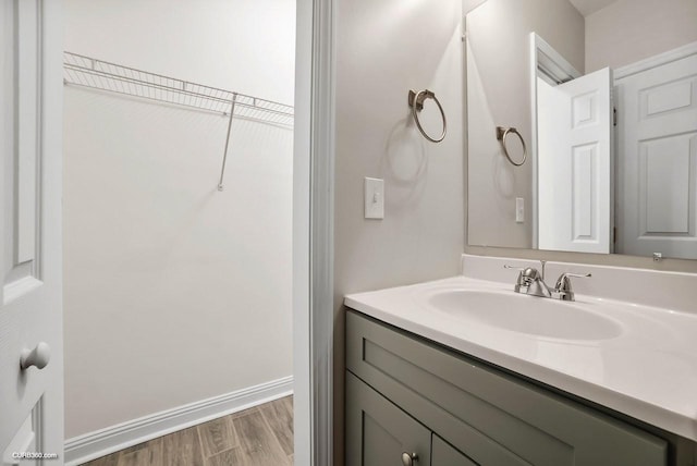 bathroom with vanity and hardwood / wood-style floors