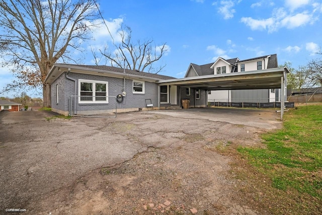 view of front of house featuring a carport