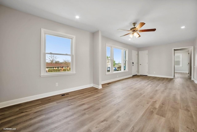 interior space with light hardwood / wood-style floors and ceiling fan