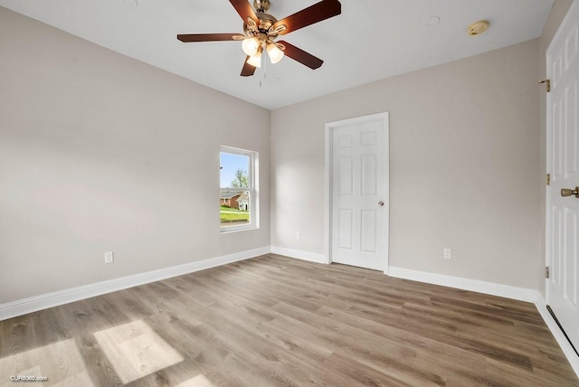 empty room with light hardwood / wood-style floors and ceiling fan