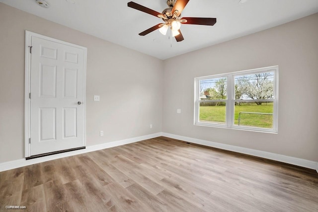 spare room with ceiling fan and light hardwood / wood-style flooring