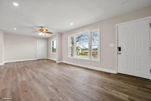 entrance foyer with ceiling fan and hardwood / wood-style floors