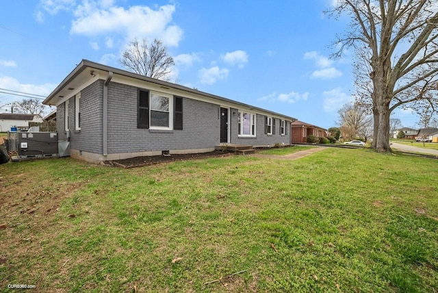 ranch-style home with a front lawn