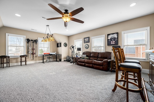 living room with ceiling fan and carpet