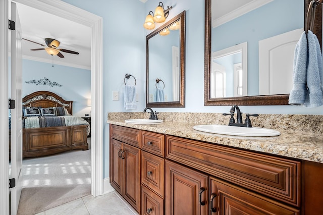 bathroom with ceiling fan, tile patterned floors, ornamental molding, and vanity