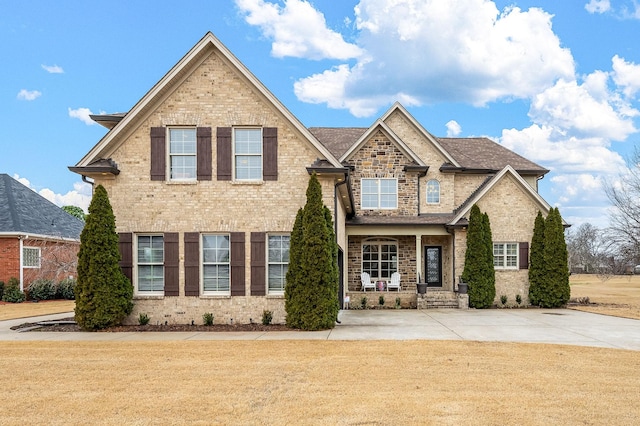 craftsman house featuring a porch and a front yard