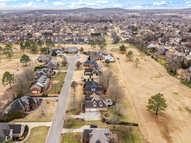 birds eye view of property with a mountain view