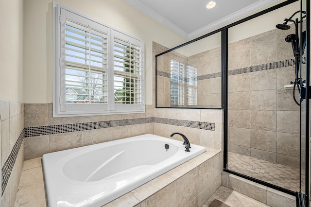 bathroom with crown molding and shower with separate bathtub