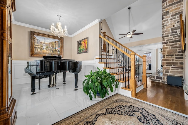 misc room with crown molding, vaulted ceiling, and ceiling fan with notable chandelier