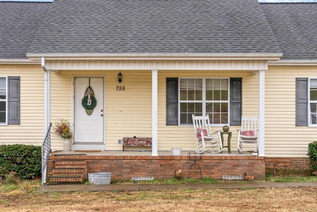 doorway to property with covered porch