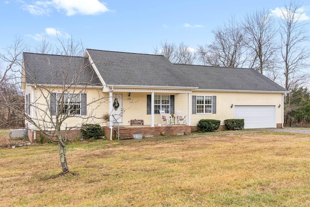 ranch-style house with a porch, a garage, and a front yard