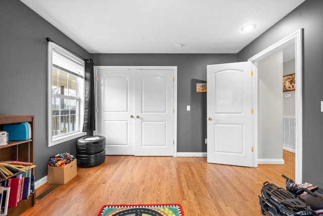 playroom with light wood-type flooring