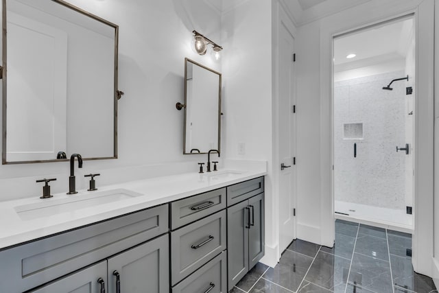 bathroom with vanity and a shower with door