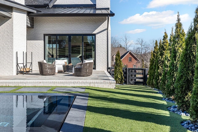 exterior space featuring a lawn and a patio