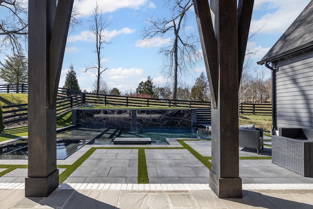 view of patio / terrace featuring pool water feature