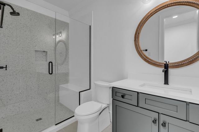 bathroom featuring vanity, toilet, and a shower with shower door