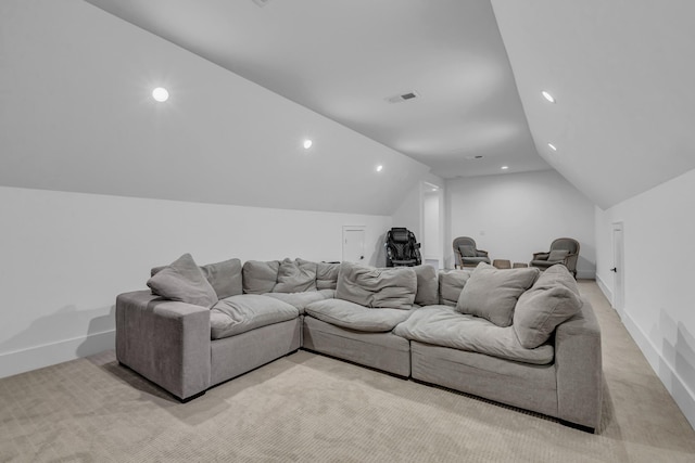 carpeted living room featuring vaulted ceiling