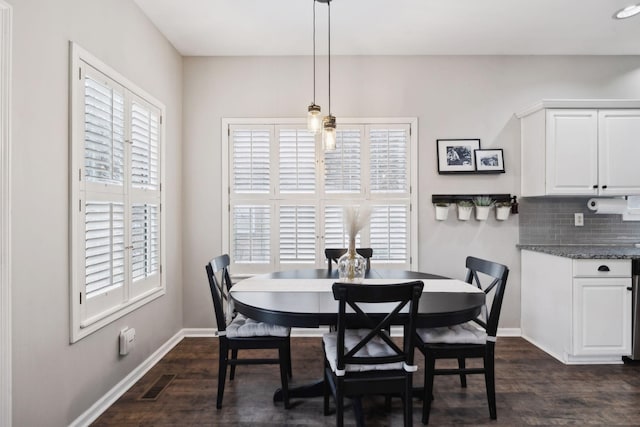 dining room featuring dark hardwood / wood-style flooring