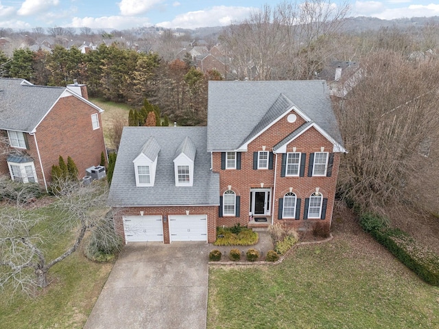 view of front of home with a garage and a front yard