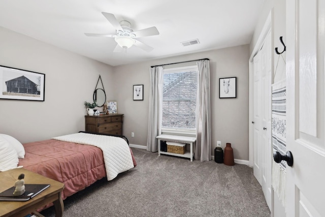 bedroom featuring carpet floors, ceiling fan, and a closet