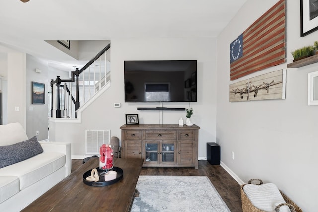 living room featuring dark wood-type flooring