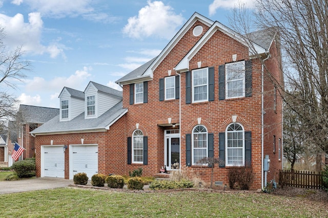 view of front of home with a garage and a front yard