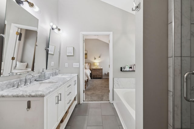 bathroom with vanity, independent shower and bath, and tile patterned flooring