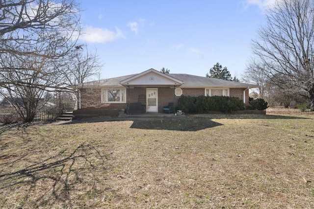 ranch-style house with a front lawn