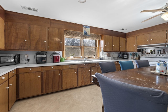 kitchen with white electric range and ceiling fan