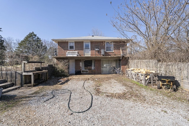 rear view of house featuring a balcony