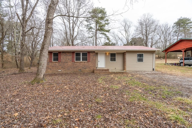 single story home featuring a carport