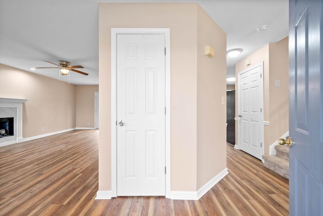 corridor featuring wood-type flooring