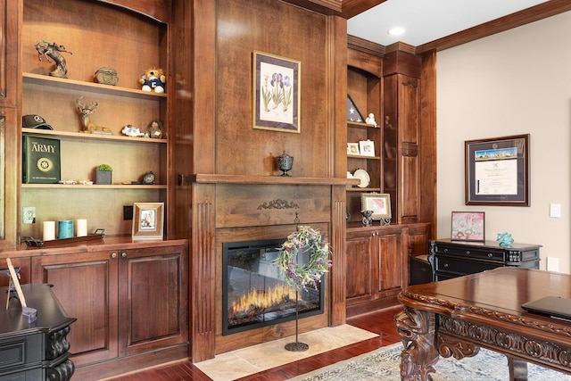 home office with ornamental molding, dark wood-type flooring, and built in features