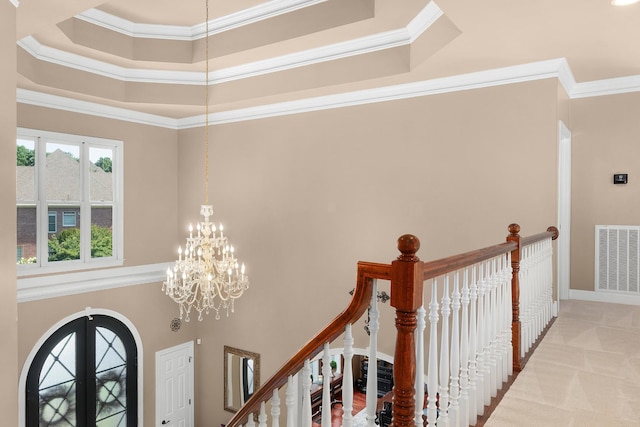 interior space featuring french doors, a towering ceiling, and crown molding