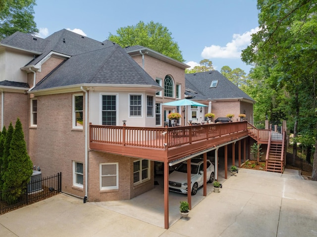 back of house featuring a wooden deck