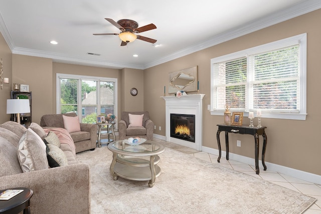 tiled living room with crown molding, plenty of natural light, and ceiling fan