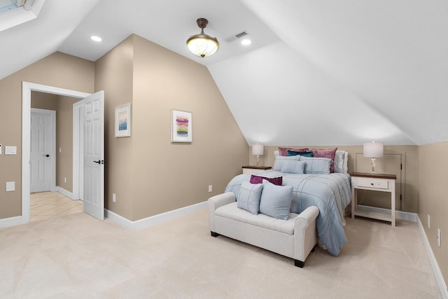 bedroom with light colored carpet and lofted ceiling