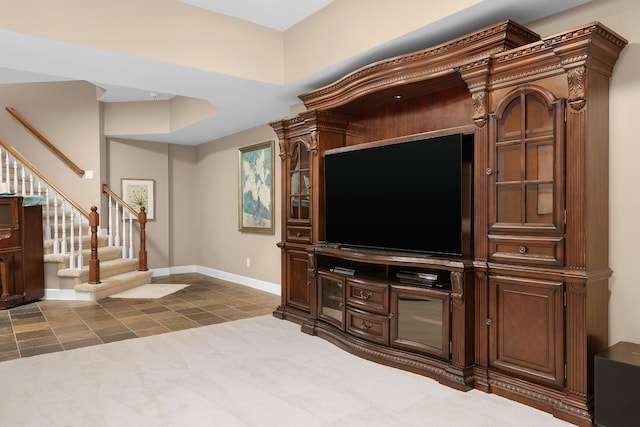 living room featuring dark colored carpet