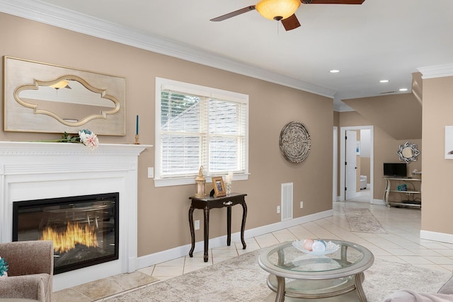 tiled living room with ornamental molding and ceiling fan