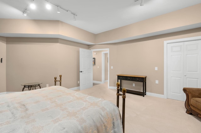 carpeted bedroom featuring a closet