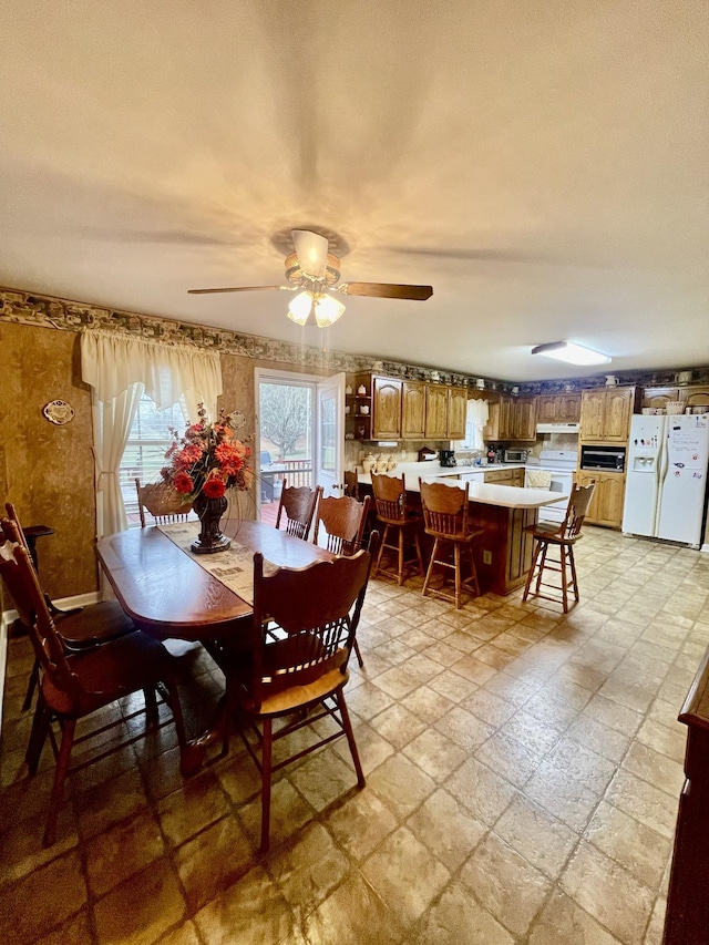 dining area with ceiling fan