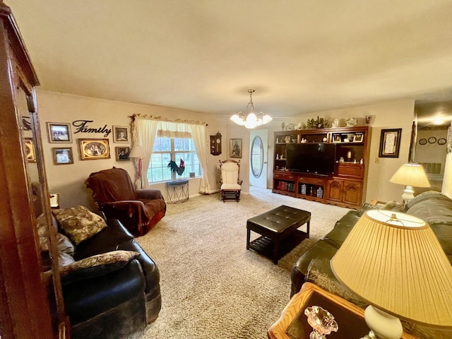 carpeted living room featuring an inviting chandelier